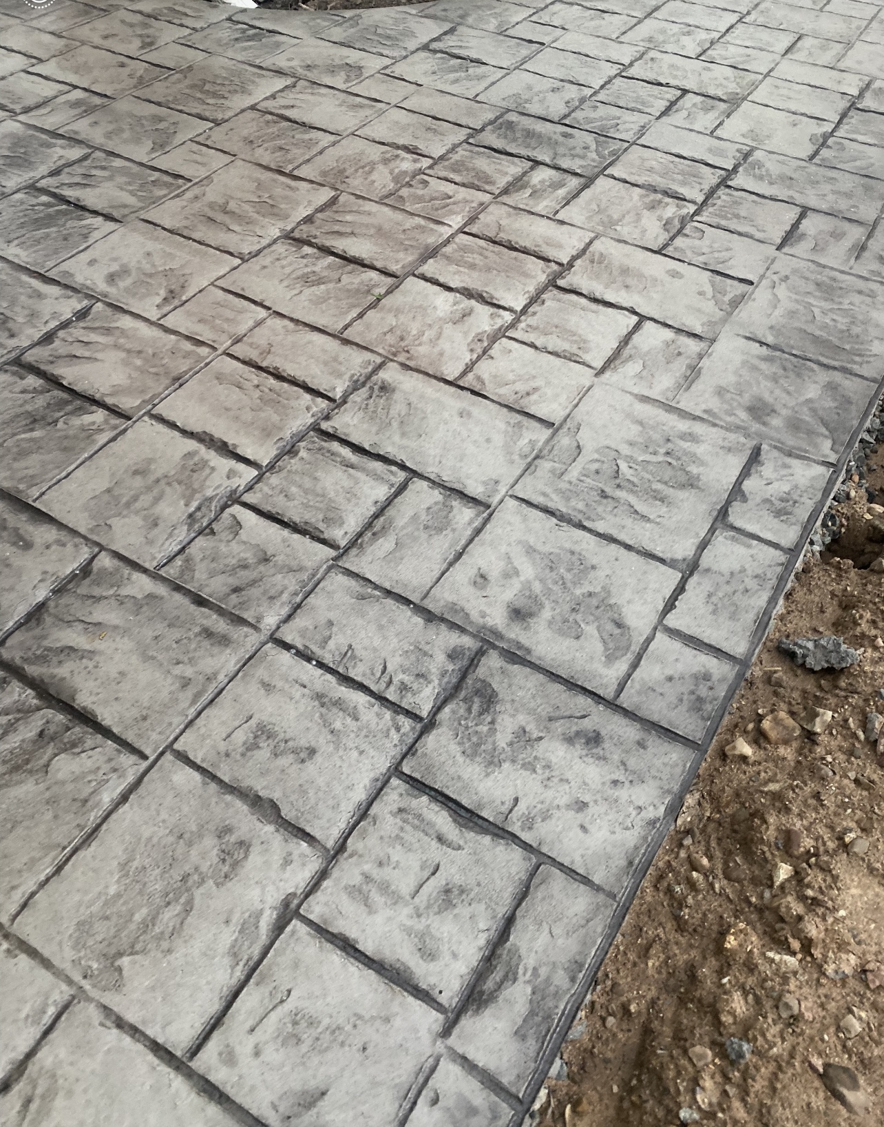 Gray ashlar cut stone stamped concrete