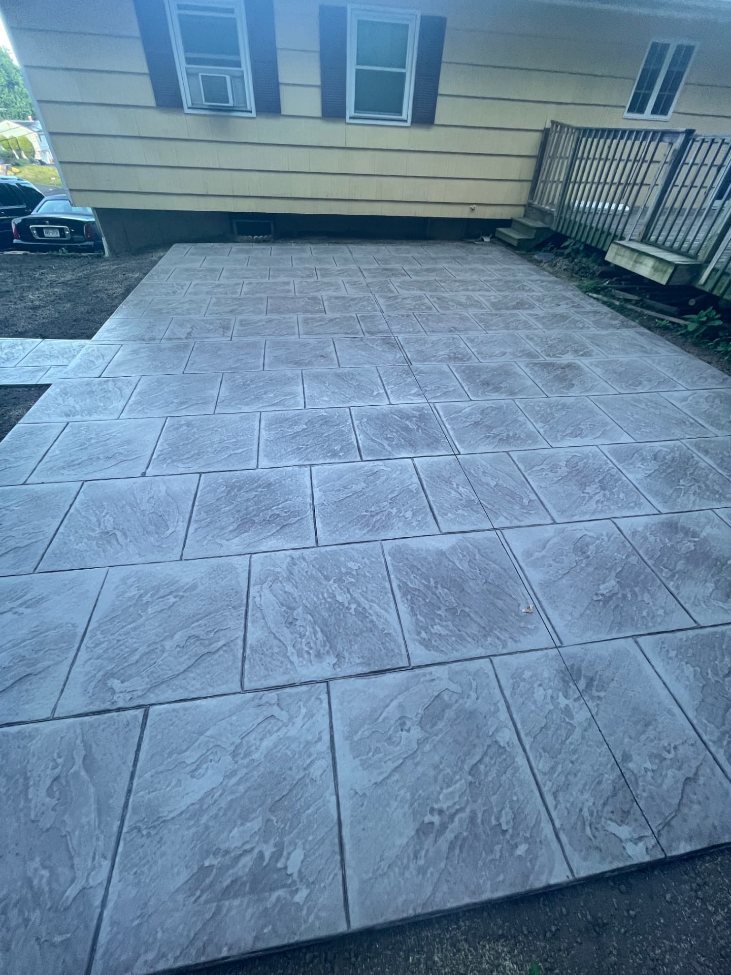 Large slate stamped concrete backyard patio