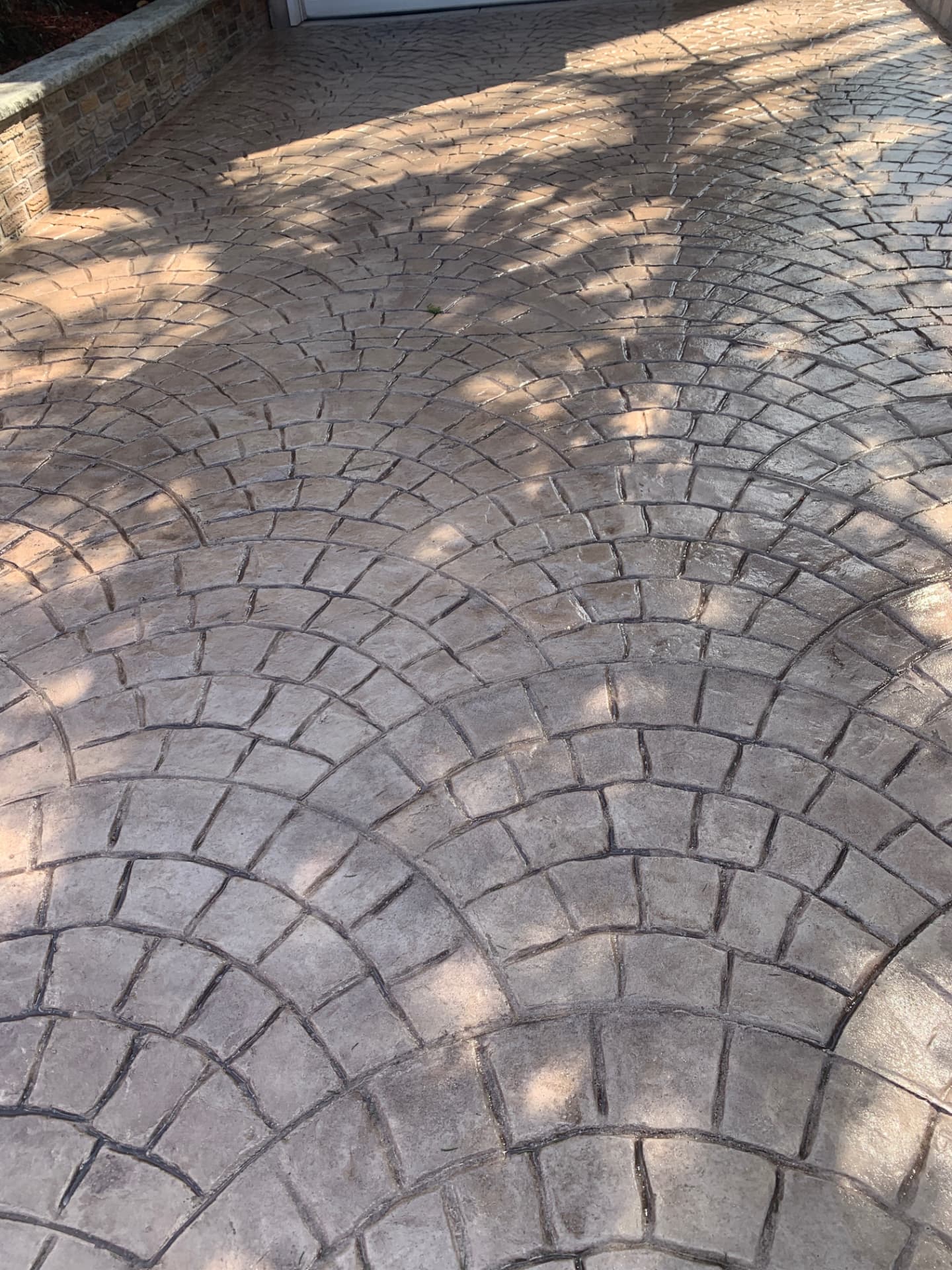 European fan cobblestone stamped concrete driveway