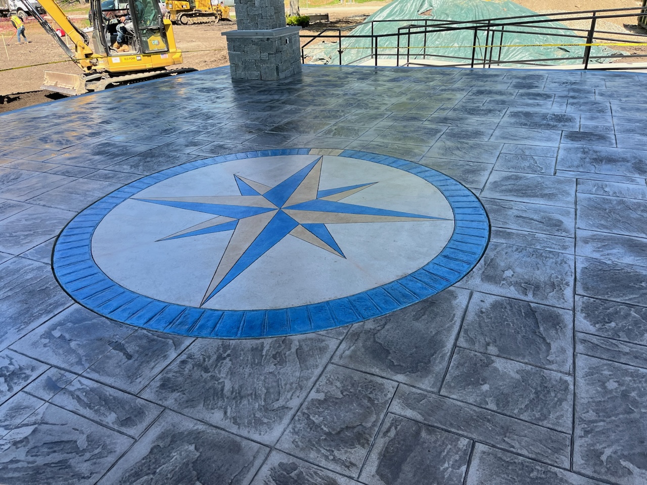 Blue compass rose stamped concrete patio