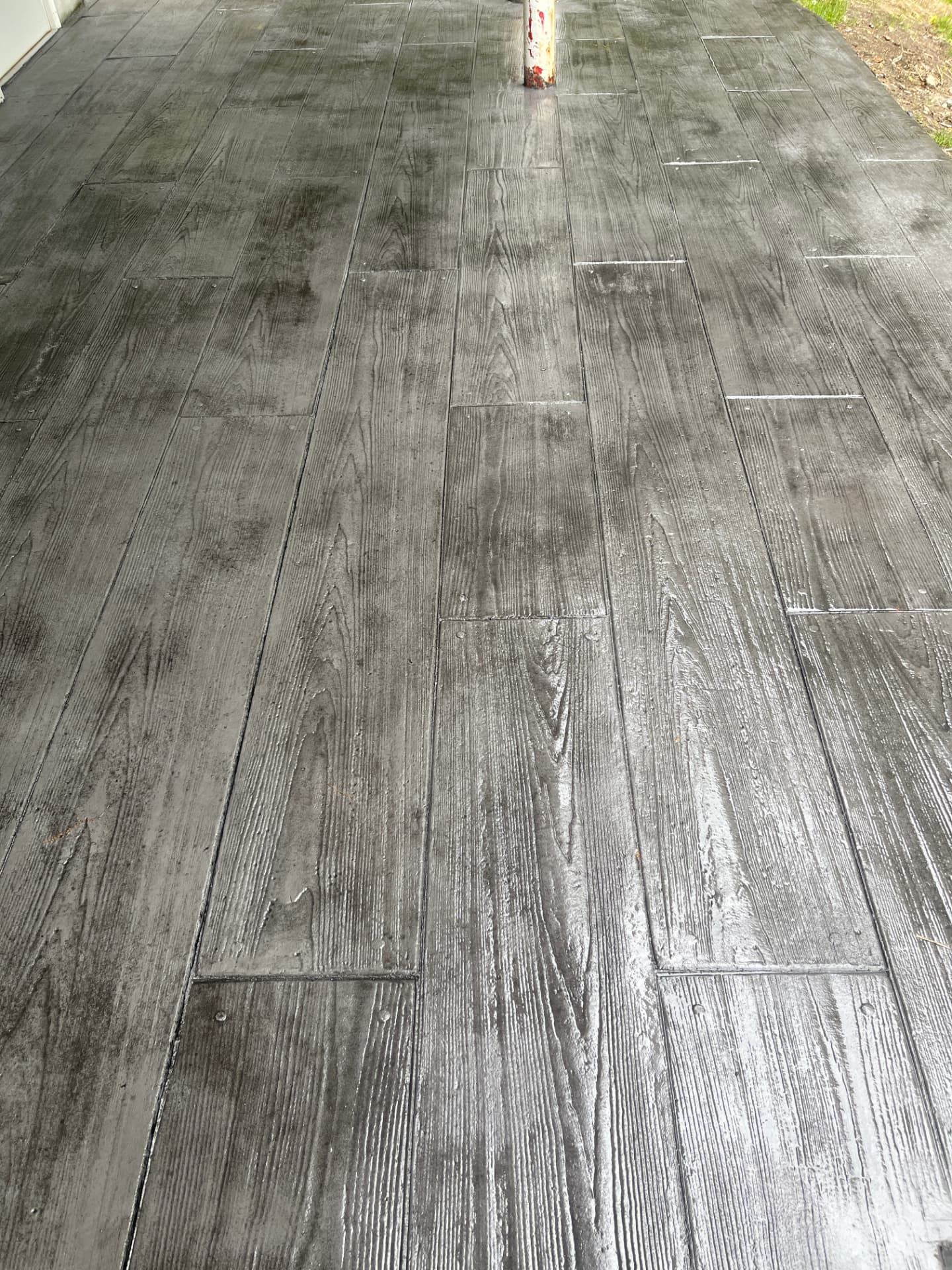 Gray wood plank stamped concrete porch